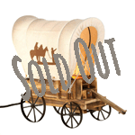 Follow the wagon trail to discover the most charming lamp on the prairie. This tabletop wooden wagon lamp features metal wheels and a wagon cover with silhouettes of cowboys and horses.
