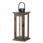Wood, metal and glass combine to create the ideal candle lantern, with a design that is equally familiar and fantastic. This inspired lighting accent features a stained wood framework, a fascinating top loop for hanging, and a vintage-inspired metal door latch.