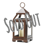 A little lantern with lots of charm! This copper-color modern lantern is small enough to fit in just about any space and add some shimmer and shine when you light a candle inside. It features four clear glass panels and a hinged door.