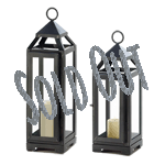Simply stunning! This sleek candle lantern is a gorgeous way to light up any room in your home, indoors or outside. The dark gray iron framework and clear glass panels let the light from a single pillar candle shine bright. Candle not included. 