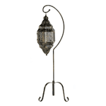Capture the drama of a deep desert night with this enchanting standing lamp! Free-swinging lattice lantern cage lets candlelight create shifting designs that dazzle and delight.