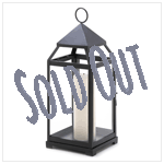 Impressive in size and simple in shape, this sleek metal candle lantern lends a clean, contemporary feel to any surrounding.