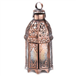 Intricate swirls of gleaming copper add luster to this dramatic candle lantern, imparting the feel of a timeless treasure. Unique double-door design is sure to add a faraway flair to any surroundings!