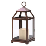 The modernized framework of this glass-paneled hurricane lamp, making it the perfect finish for any special setting. A handsomely understated addition to your favorite room! Loop at top for hanging; can also stand freely on table or shelf.