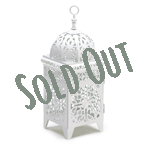 Bright white and intricate floral filigree add fresh appeal to this birdcage lantern! As candlelight shines through the cutout panels in a kaleidoscope display, your porch or patio comes alive with jubilant points of light! Candle not included.