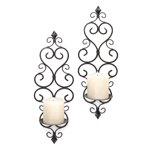This dazzling duo of candle sconces will dress up any wall with continental style and flair. Just add pillar candles, and the intricate scrolling metalwork design of this sconce set will shine! 