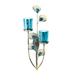 The majestic beauty of peacock feathers will grace your wall with sparkle and shine! This attractive wall sconce features a multi-tone finish, faceted peacock blue buds surrounded by fanning metal plumes, and two peacock-patterned candle cups. 