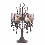 Light the night with breathtaking splendor! The Midnight Elegance Candelabra is the perfect centerpiece for a romantic table setting, combining the shadowy glow of five candles behind tinted glass and glamorous faceted baubles. 