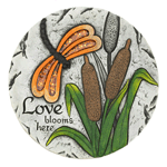 Give your garden a warm and welcoming touch with this "Love blooms here" stepping stone. The decorative stone features a serene design of a dragon fly with glittery orange wings that will sparkle in the sunlight. 
