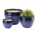 House your plants in these stylish blue tone planters. This set of ceramic planters includes three pots of various sizes in a serene two-tone blue finish. Mix and match these planters for indoor and outdoor use or display as a set on top of your favorite plant stand.