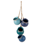 Straight from the kitchen of a Santa Fe gourmet, this darling decoration recalls the fabled cooking pots treasured for generations in the Southwest. Four graceful ocean toned vessels with jute hanging loop are ready to brighten any corner