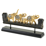 This bejeweled family of elephants brings good luck and great design to your living space! The polystone carving features a wood-like texture that is inset with four beautiful ivory-inspired elephants dressed with dazzling accents. 