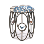 Give this adorable stool a permanent home and delight as the compliments flock to you! This metal-framed stool features three colorful bird statuettes, and the top cushion is covered with a fascinating linen patterned fabric that is the perfect finishing touch. Spot clean only. 