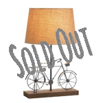 Warm up your room with the diffused light of this charming and whimsical table lamp. It features a wooden base, a linen lamp shade, and in between is an iron bicycle that will brighten your room with style even when the lamp is switched off. 