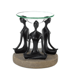 Meditate with help from your favorite aroma, as scented oil heats up in this lotus-pose oil warmer. Stone-look base and black figurines hold a clear glass oil basin and tealight candle holder. Candle and oil not included. 