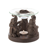 Three talented elephants are on parade to fill your home with delightful aroma. This unique oil warmer features a sculptural base that holds a tealight candle, and a glass oil basin rests atop their outstretched trunks.