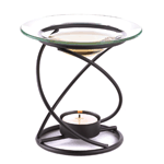 A graceful spiral base supports a clear glass oil dish, along with a warming tealight below. Just add a few drops of fragrant oil for a gently scented glow!