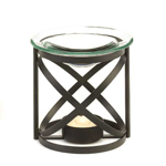 Your eyes will be positively fixed on this striking and modern oil warmer, while your nose will revel in the pleasing aroma. The glass oil basin harmonizes with the dark metal structure for a perfect accent to any rooms atmosphere. 